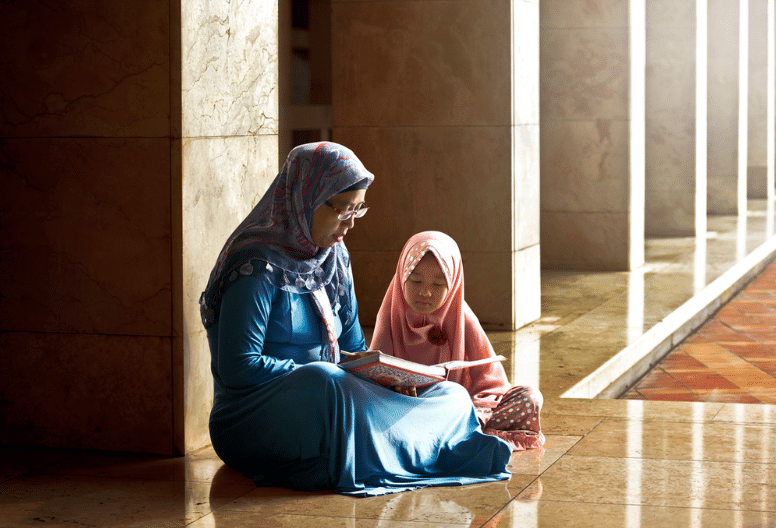 Woman praying with child